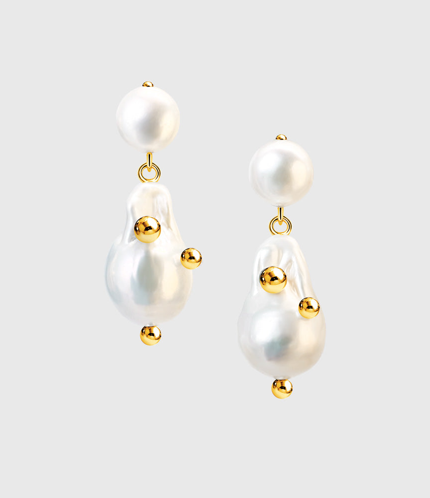 Helmia pearl stud earrings in gold front